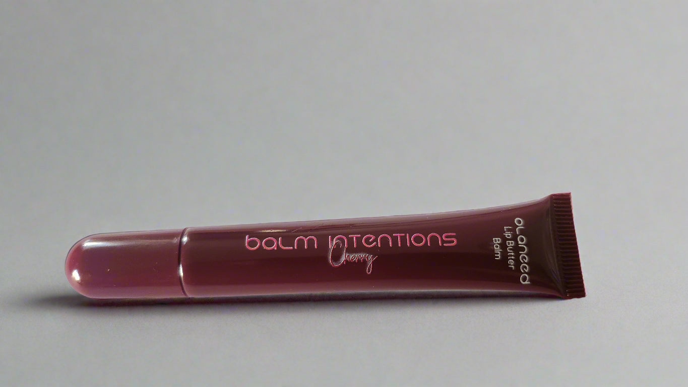 Lip balm tube labeled 'balm intentions' on a white background