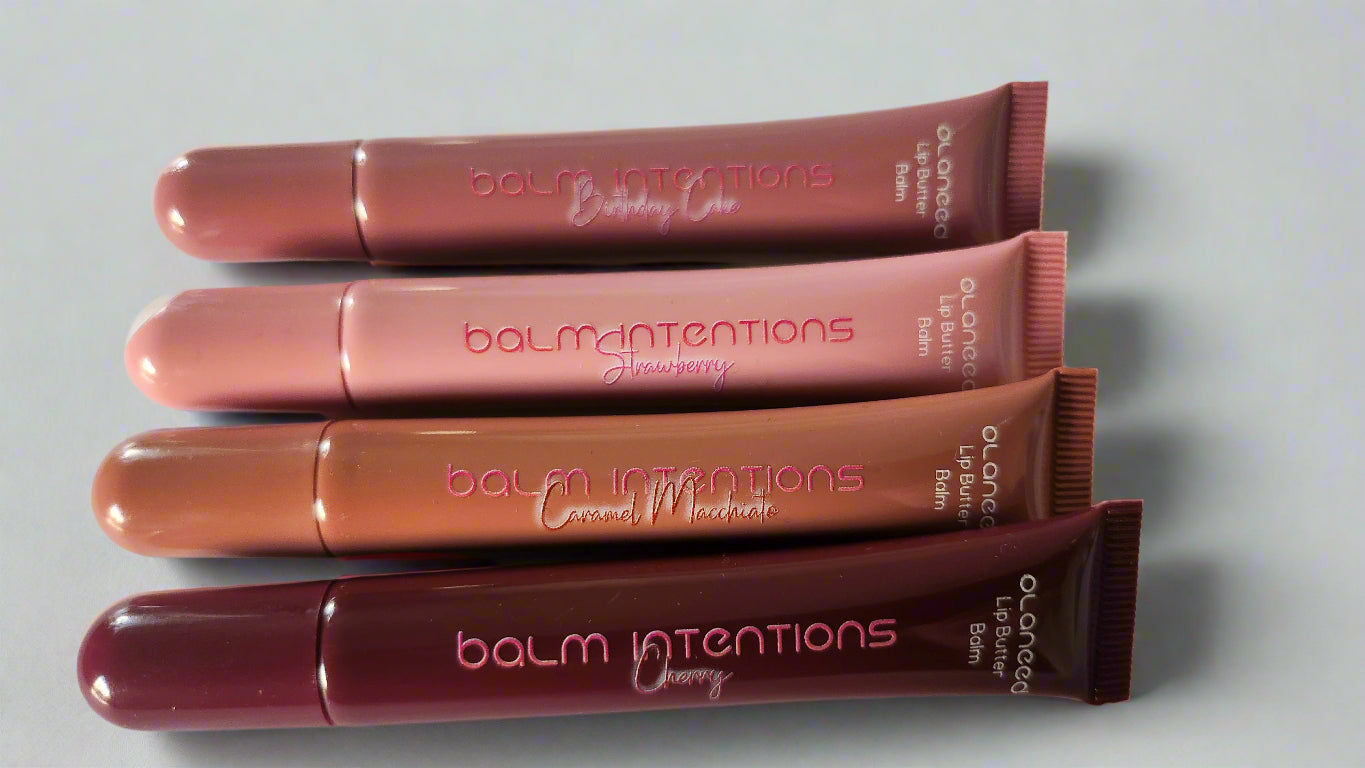 Four lip balm tubes from the brand 'balm intentions' on a white background